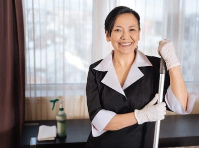 a member of the janitorial staff smiling