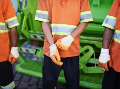 Collecting your trash. Cropped shot of a garbage collection team.