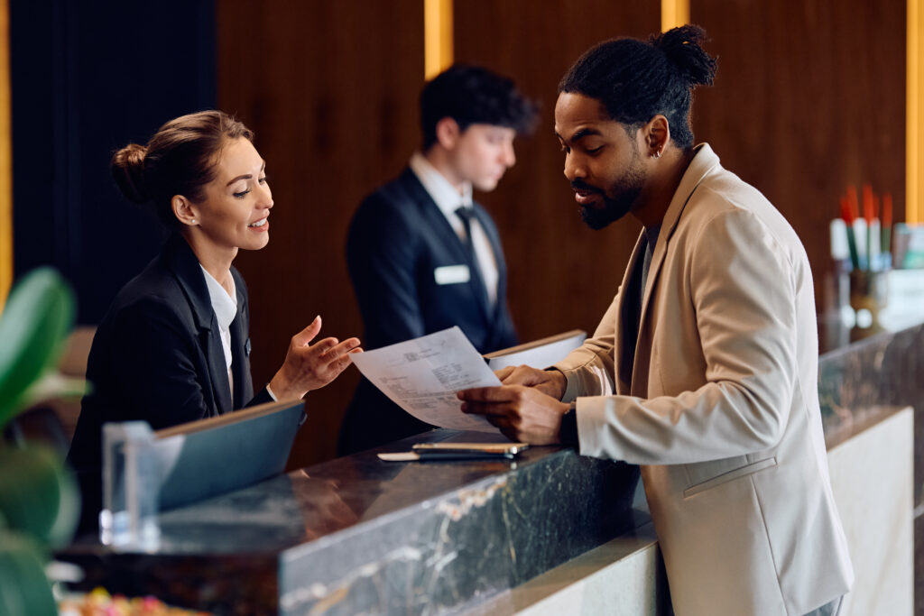 Reception area with professionals discussing documents, highlighting Pinnacle Janitorial Services, Parsippany, New Jersey quality.